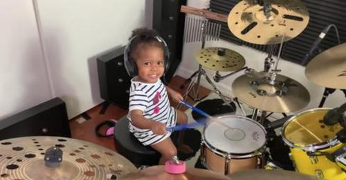 Skilled 21-month-old baby girl plays captivating drums cover like a professional