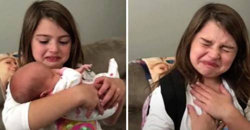 Little girl is excited to see her baby sis for the first time